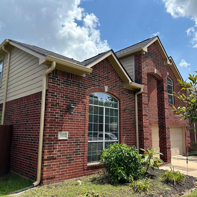 Tamko Titan XT Rustic black roof on brick house