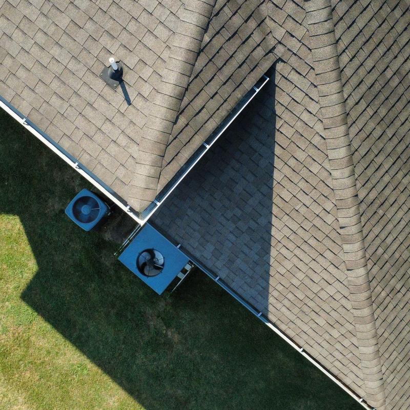 Asphalt shingle roof with visible hail impact areas