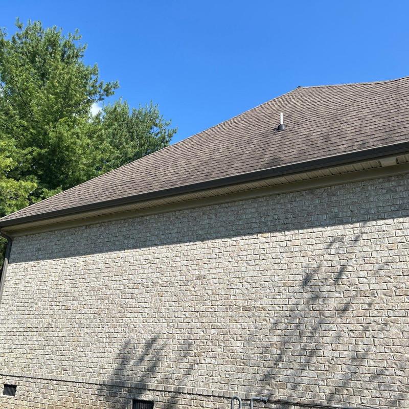 Asphalt shingle roof with gutter and vent pipe