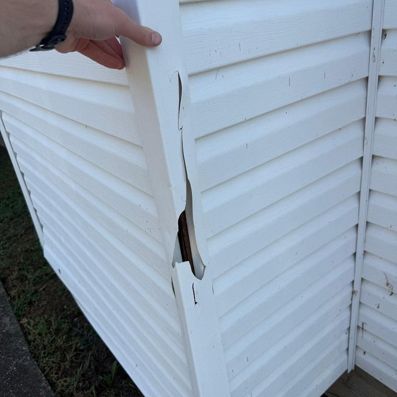 Vinyl siding panel with severe cracking damage