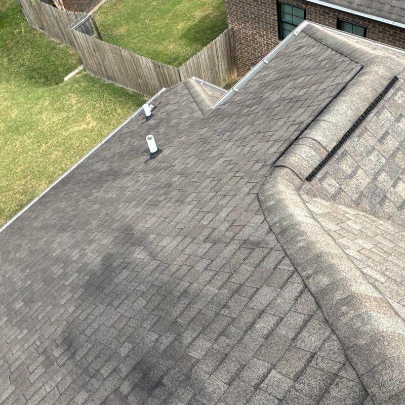 Asphalt shingle roof with hail damage inspection