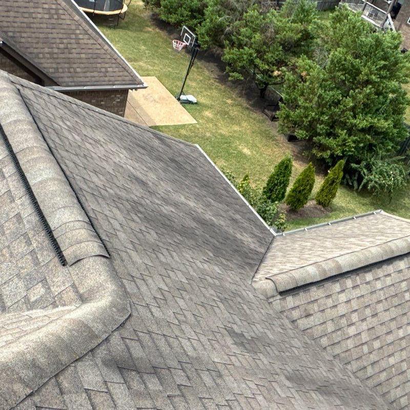 Asphalt shingle roof with ridge caps and valleys
