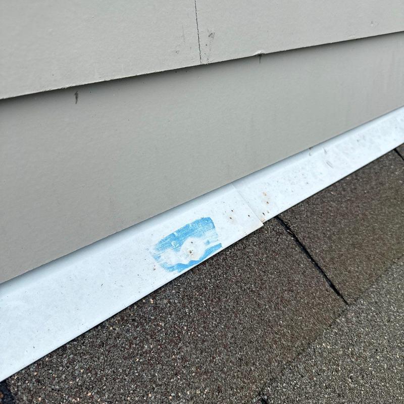 Flashing with hail damage near roof shingles