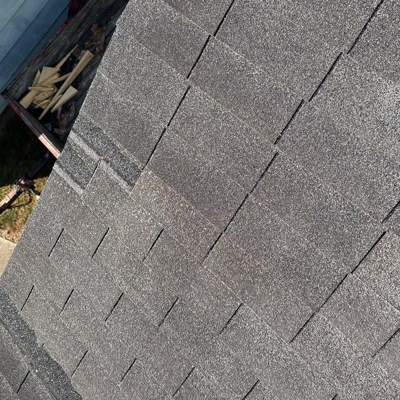 Asphalt shingles with hail damage inspection on roof