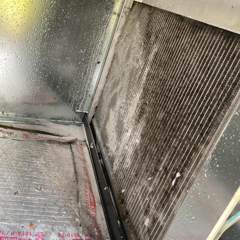 Evaporator coil cleaning inside HVAC unit