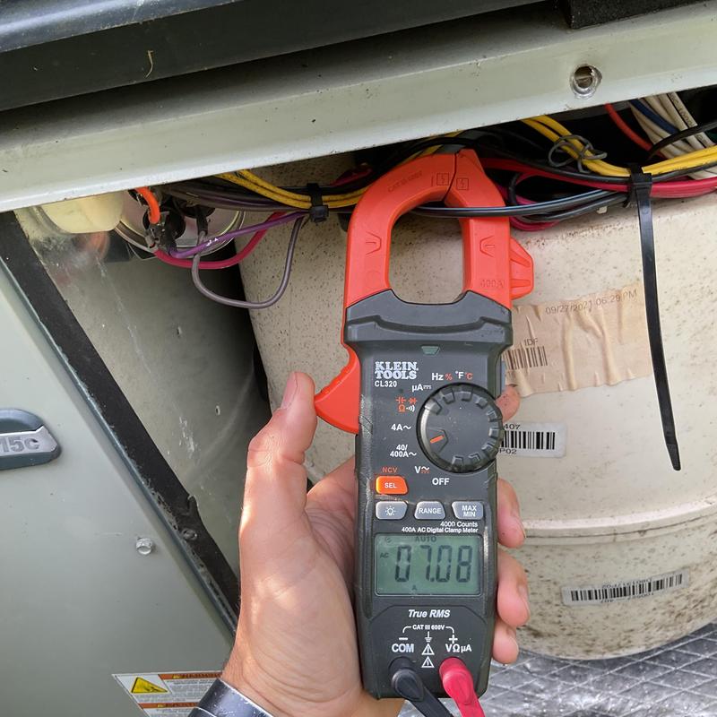 AC unit electrical current testing with clamp meter