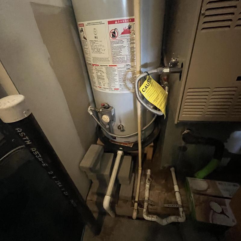 50-gallon gas water heater with plumbing connections