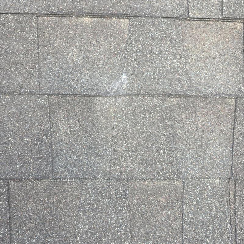 Asphalt shingle roof with minor hail impact marks