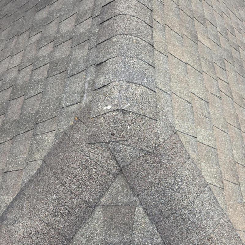Asphalt shingle ridge with minor granule loss