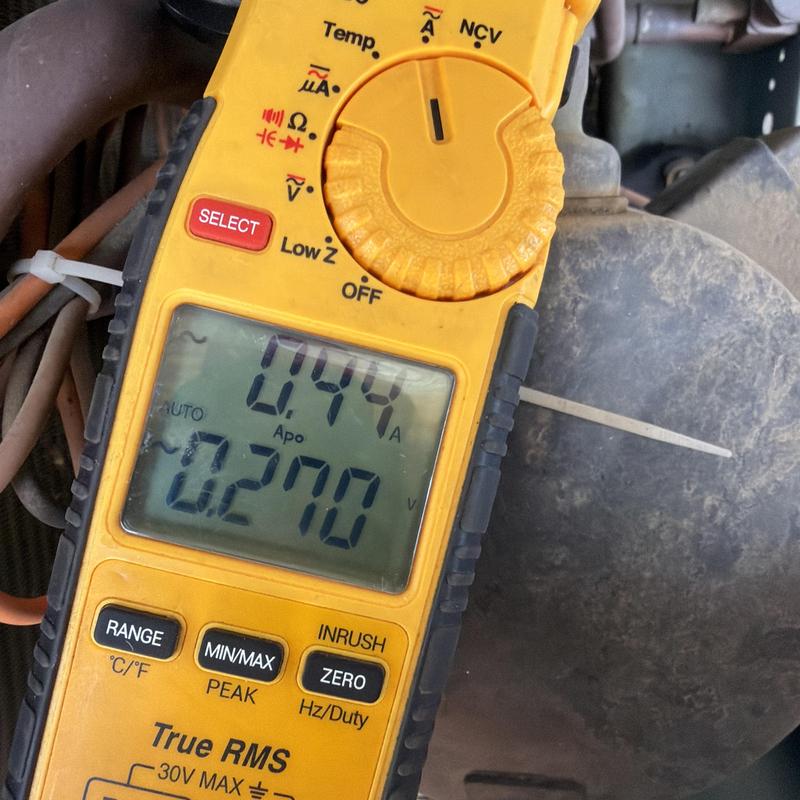 Multimeter measuring HVAC system electrical current