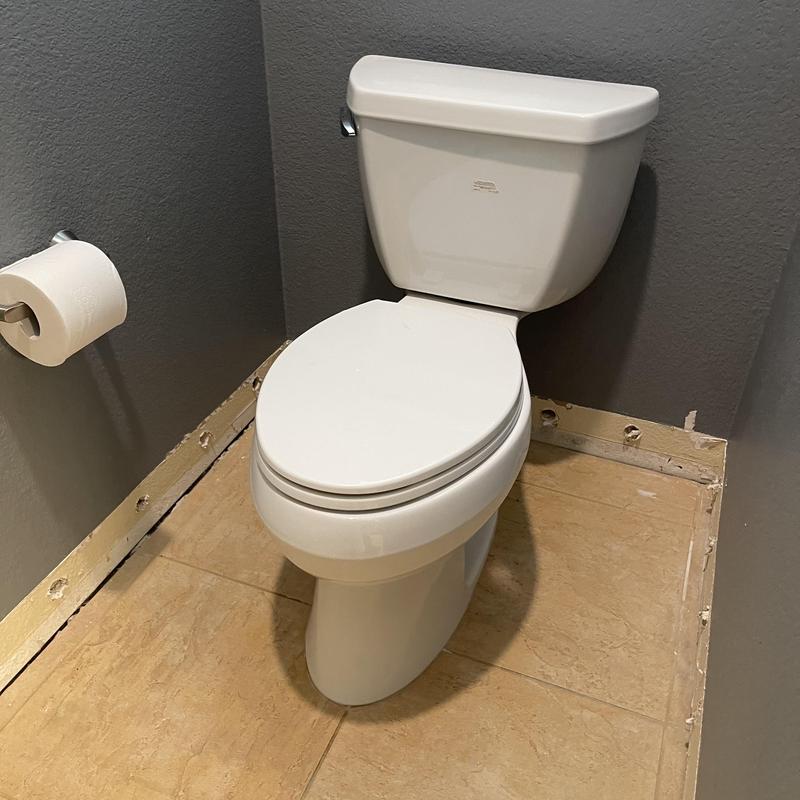 Toilet installation with new wax ring and hardware