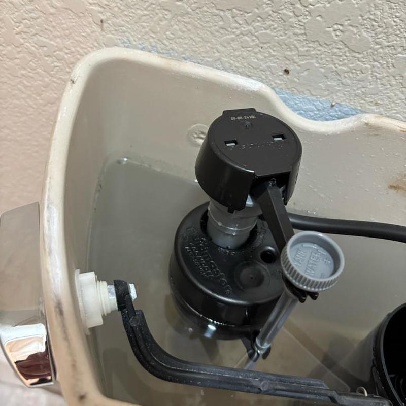 Toilet flush valve and fill valve installation inside tank