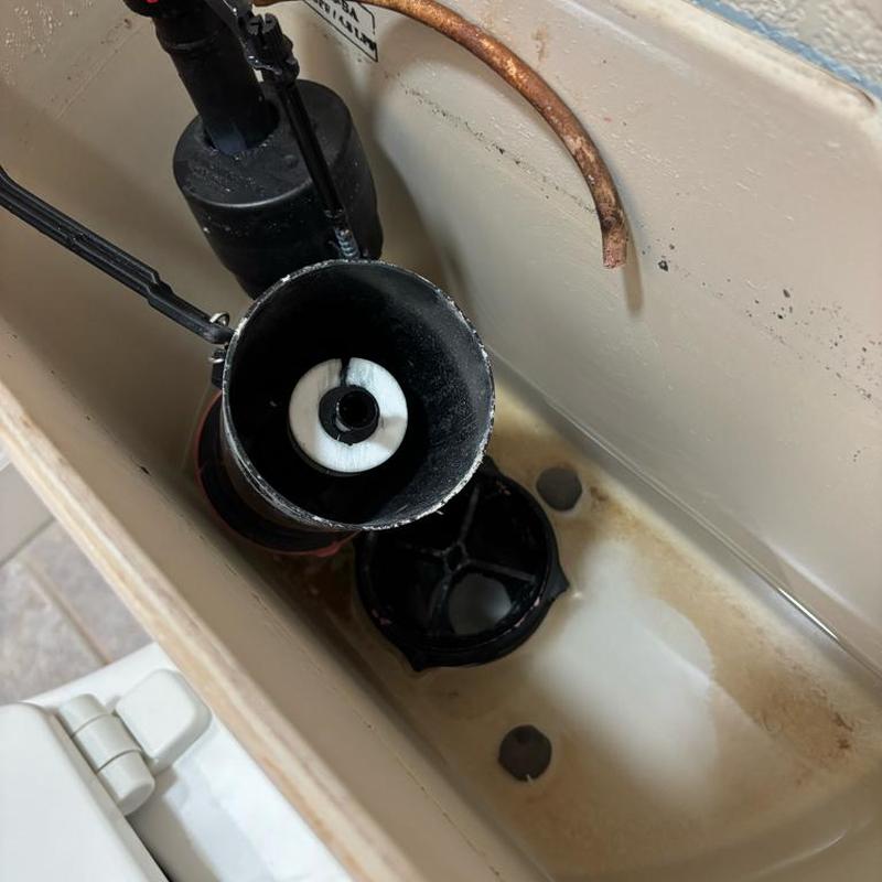 Toilet flush valve and fill valve installation inside tank