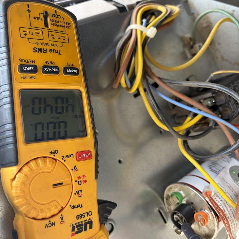 Capacitor and multimeter testing in HVAC unit wiring