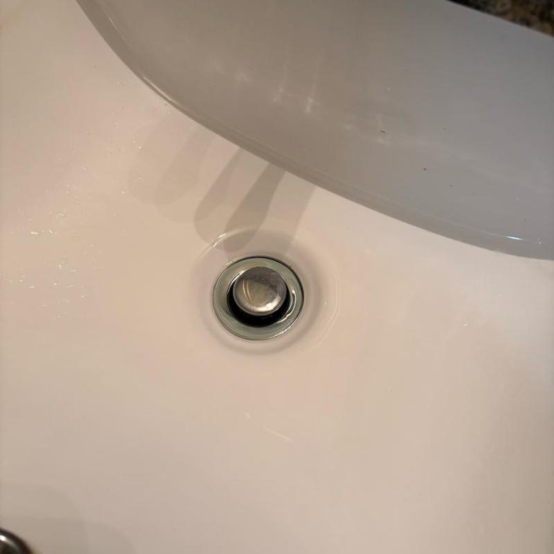 Bathroom sink pop-up stopper and drain cleaning