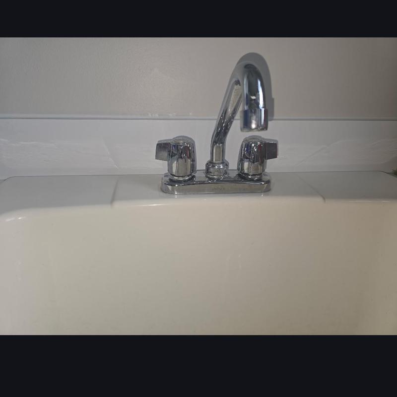 Laundry tub faucet with new cartridge installation