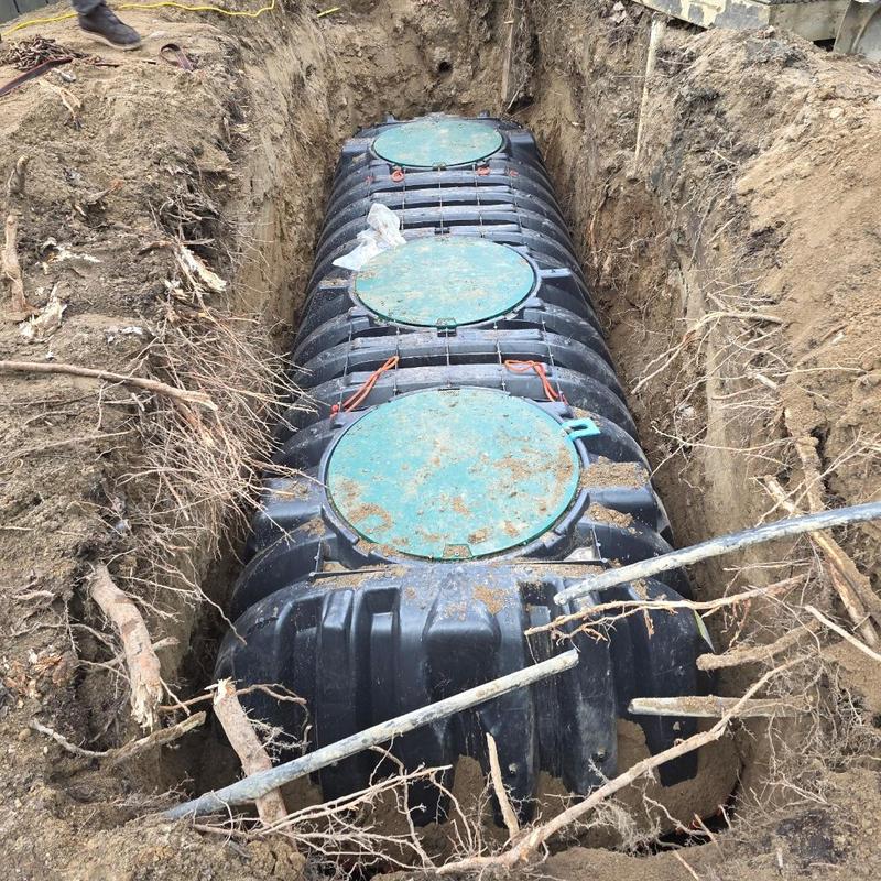1500-gallon septic tank installation in trench