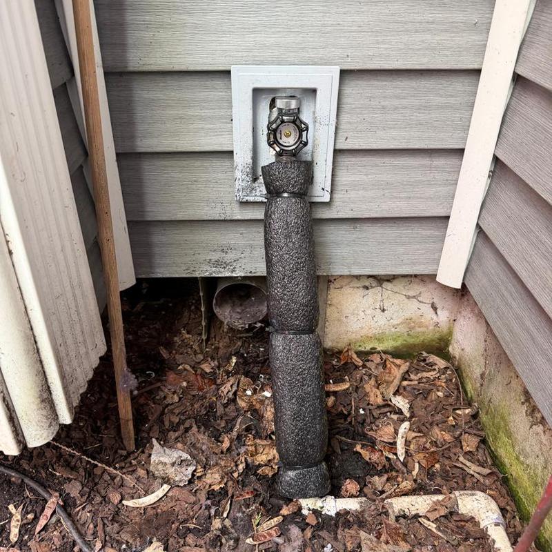Hose bib with insulation sleeve on exterior wall