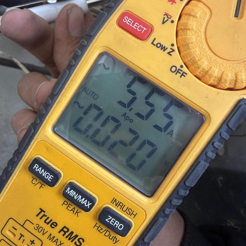 Multimeter measuring current and voltage readings