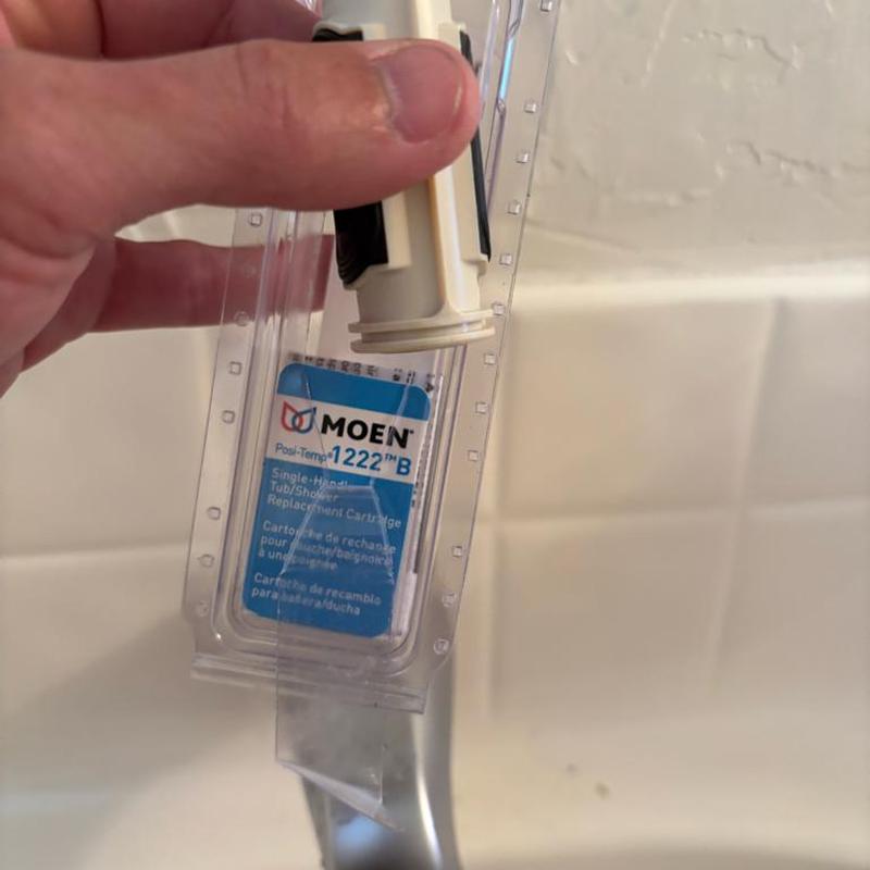 Tub shower cartridge replacement with packaging visible