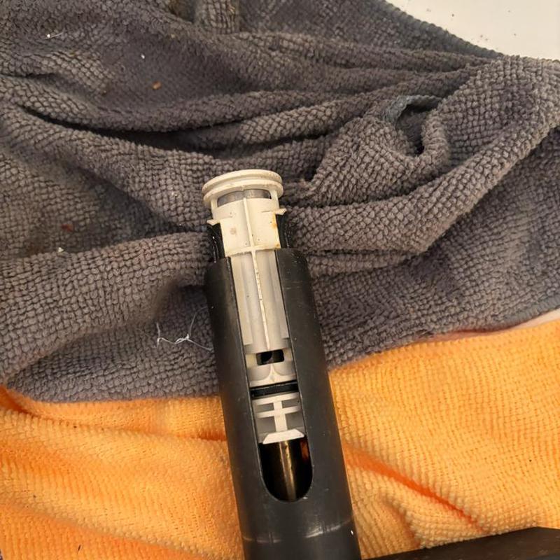 Tub cartridge valve on towels in plumbing repair