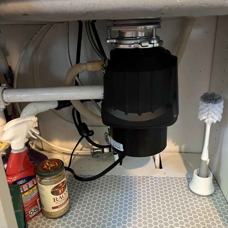 Garbage disposal unit replacement under kitchen sink