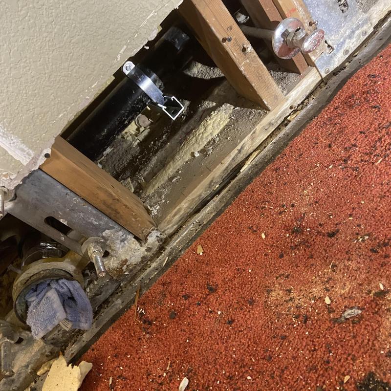 Cast iron toilet drain section replacement in wall cavity
