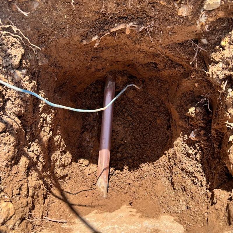 Water main pipe access hole excavation in soil