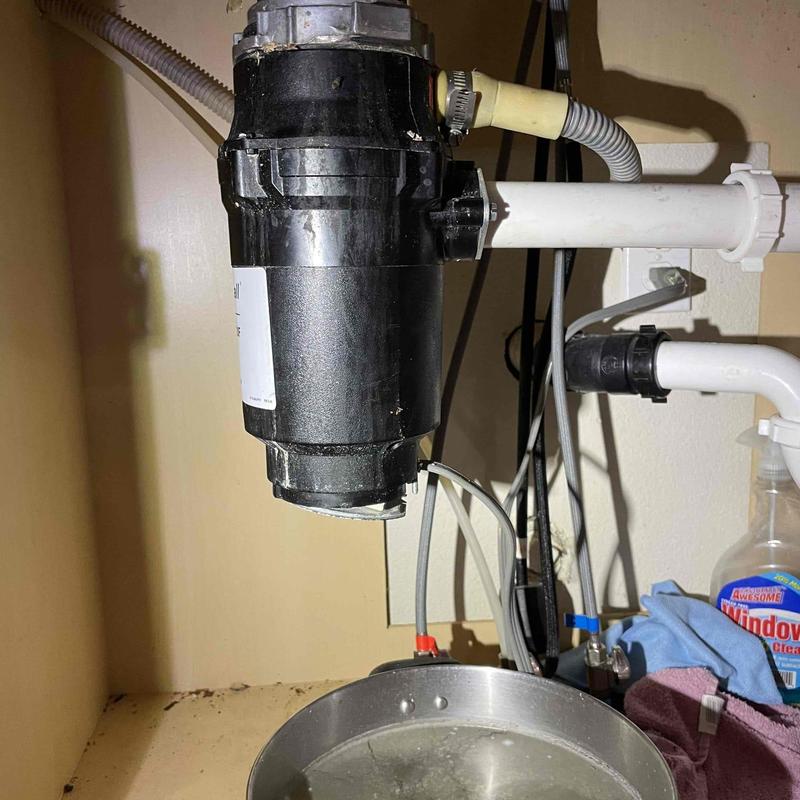 Garbage disposal with cleared blockage under sink