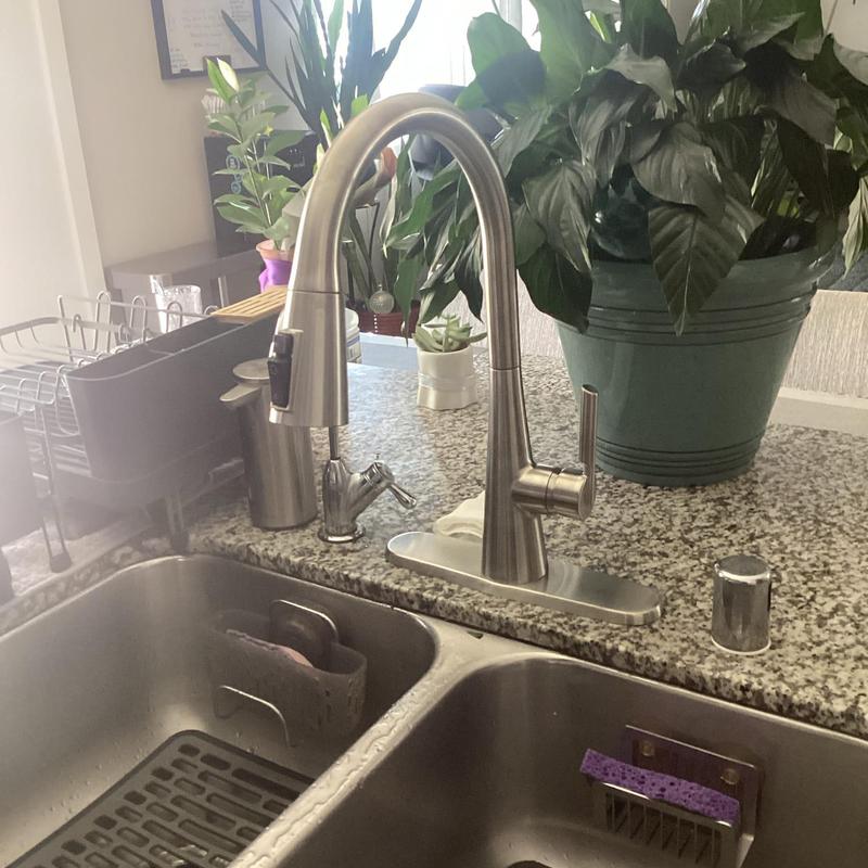 Kitchen faucet with pull-down sprayer on granite counter