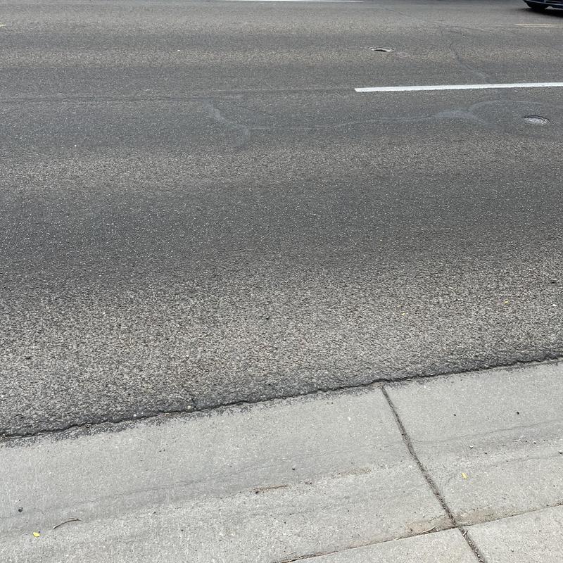 Sewer rooftop vent hydro jetting on city street curb