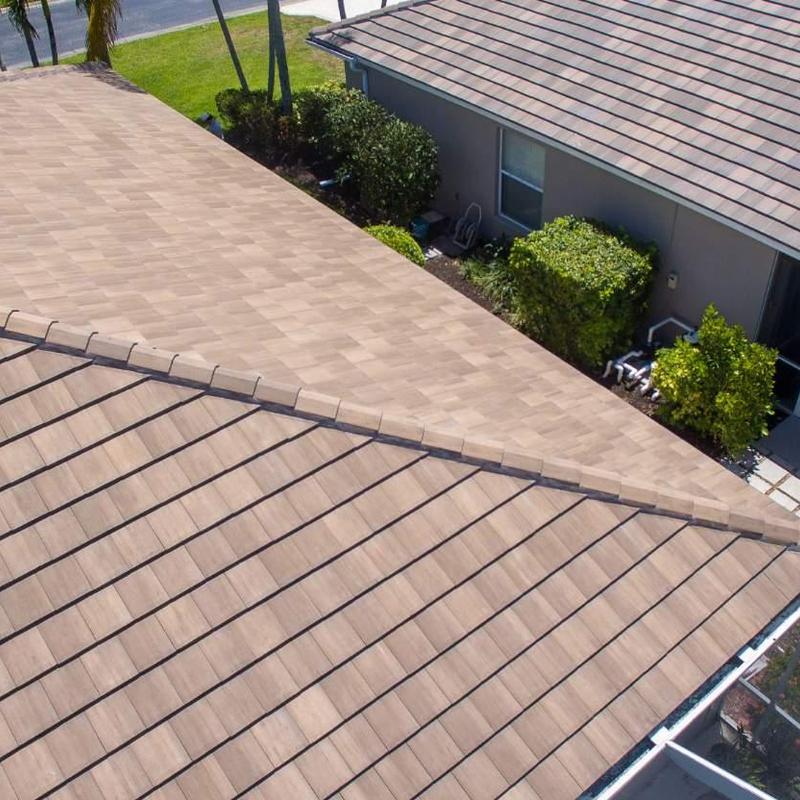 Concrete tile roof with repaired ridge cap in Fort Myers
