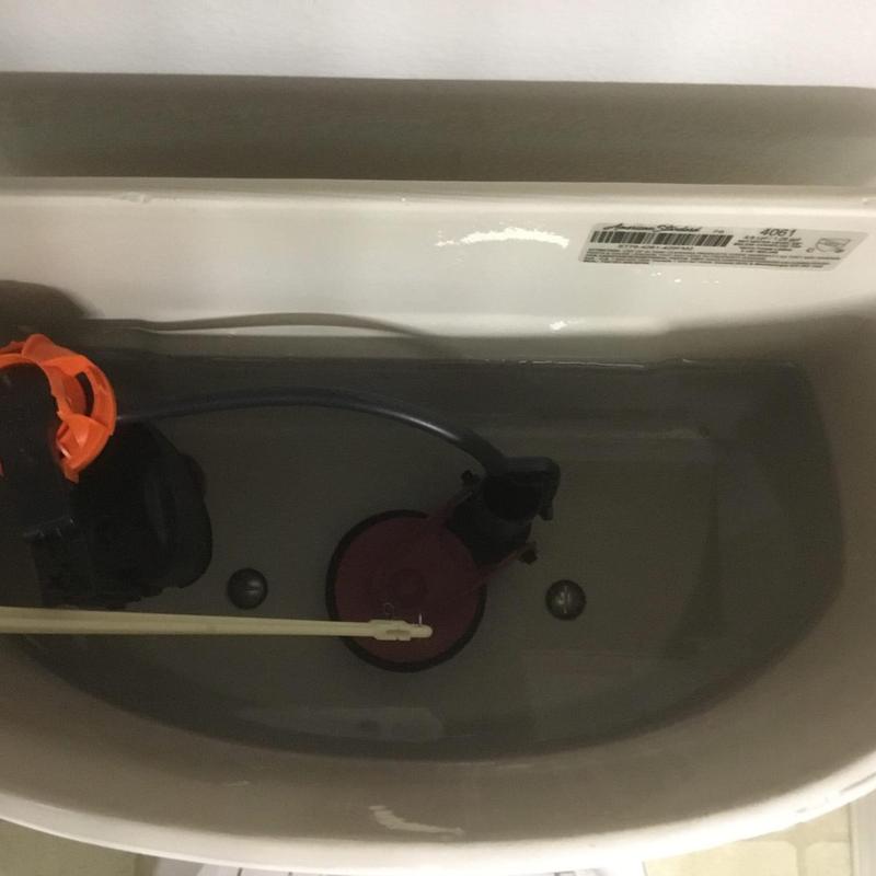 Toilet tank with fill valve and flush mechanism maintenance