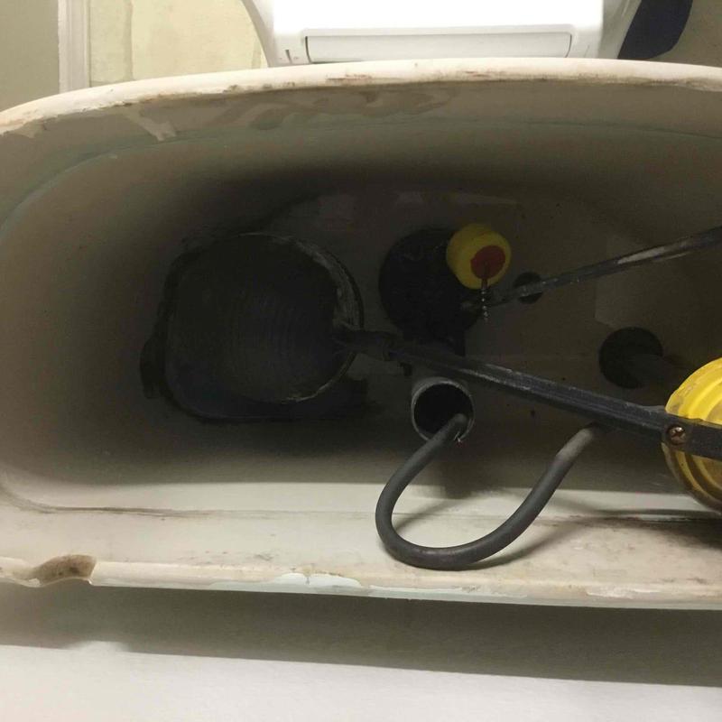 Toilet tank interior with flapper and fill valve components