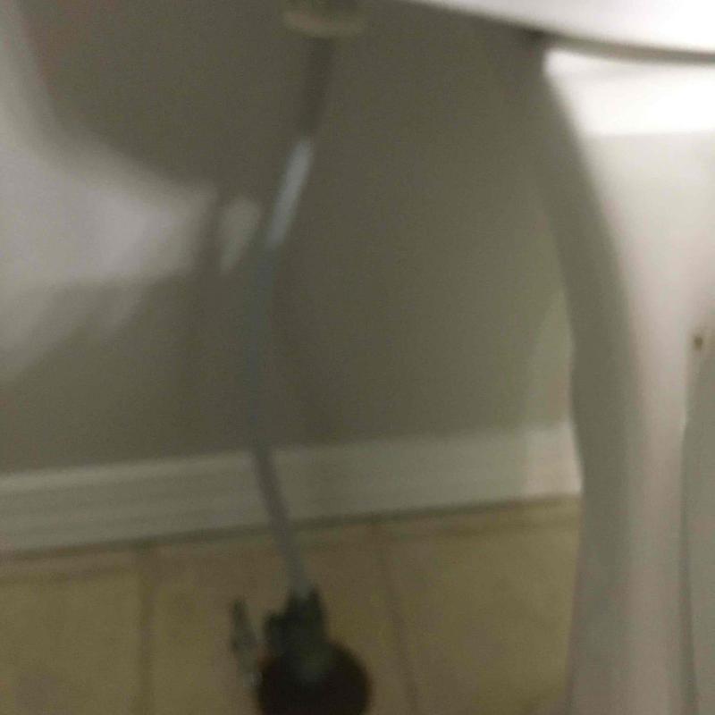 Toilet water supply line connection under bowl
