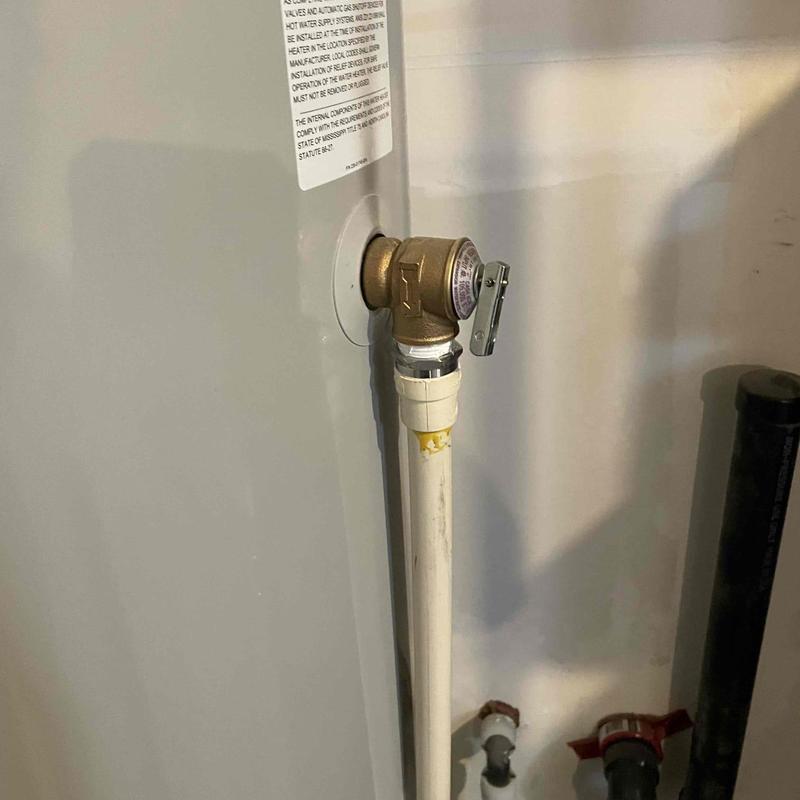 T&P valve on water heater with attached pipe