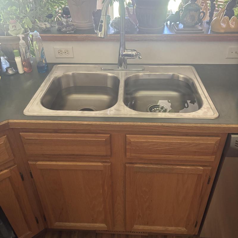Kitchen double stainless steel sink with faucet installed