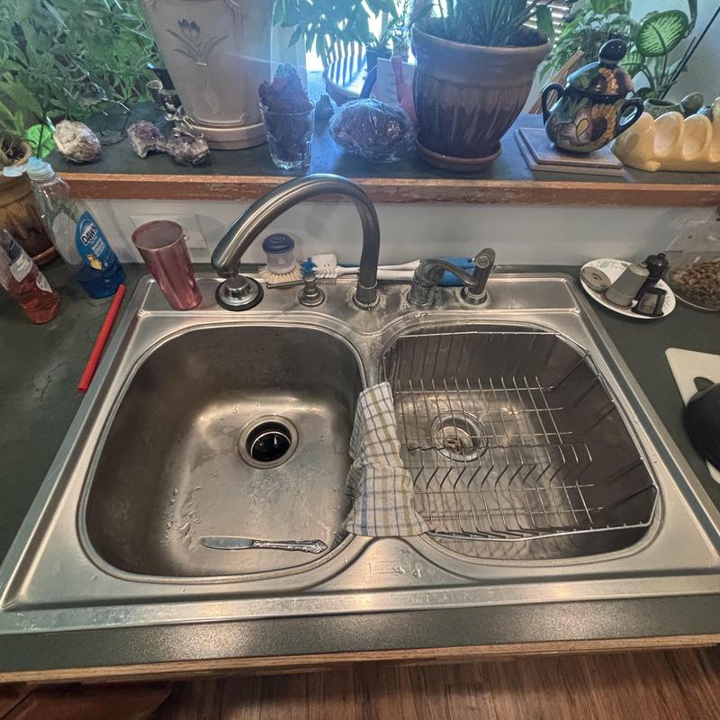Kitchen sink and faucet with drying rack and towel