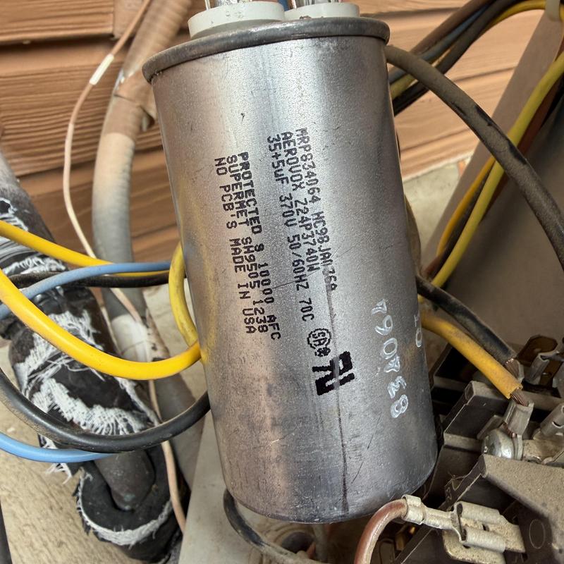 HVAC capacitor with yellow and blue wiring connections