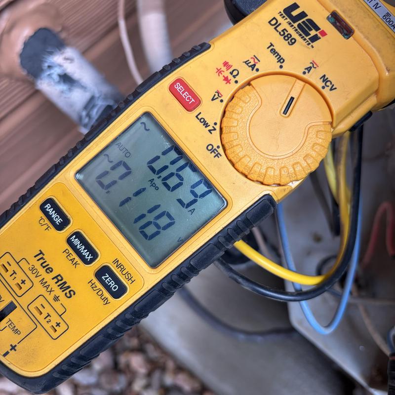 Clamp meter measuring HVAC system current in Colorado Springs