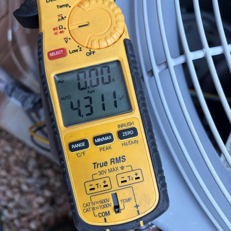 Capacitor testing with digital multimeter on AC unit