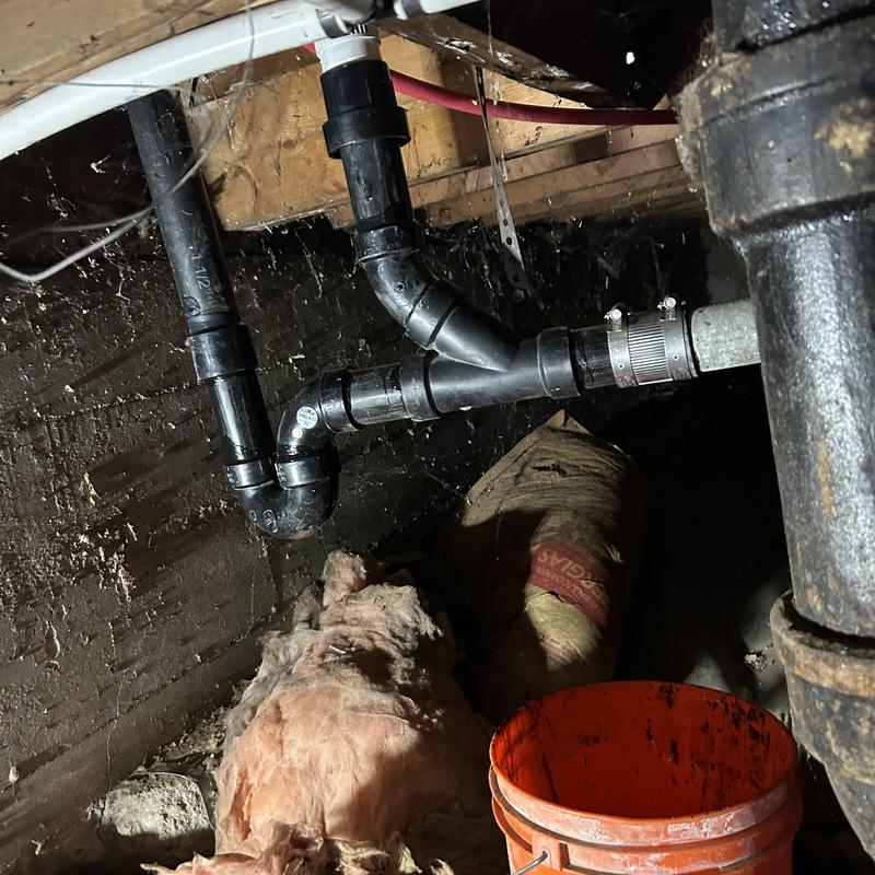 P-trap assembly replacing old drum trap in crawl space