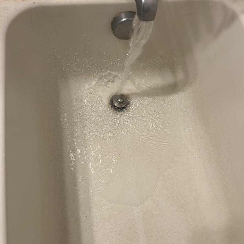 Bathtub drain with running water draining smoothly