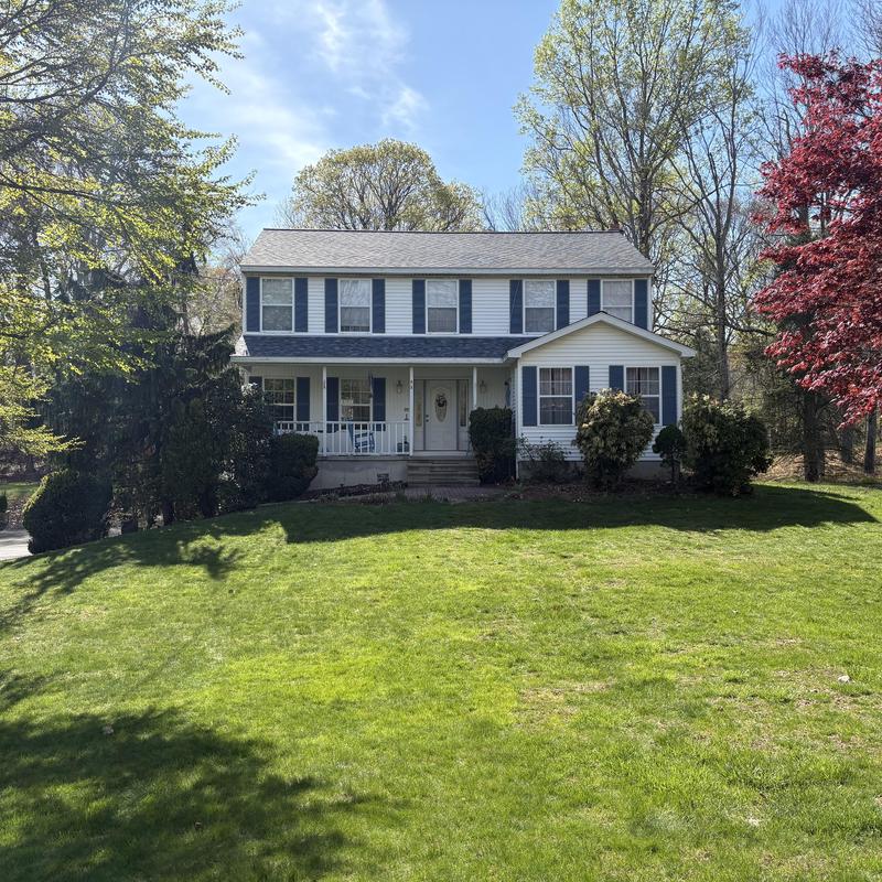 Lifetime asphalt shingle roof on two-story house