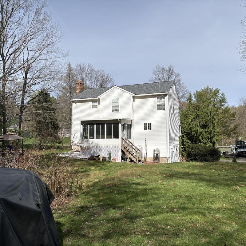 Lifetime roof system on white two-story house