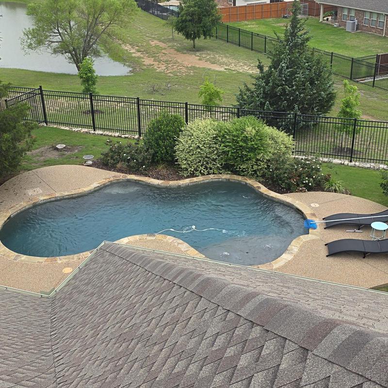 Asphalt shingle roof with pool and landscaping view