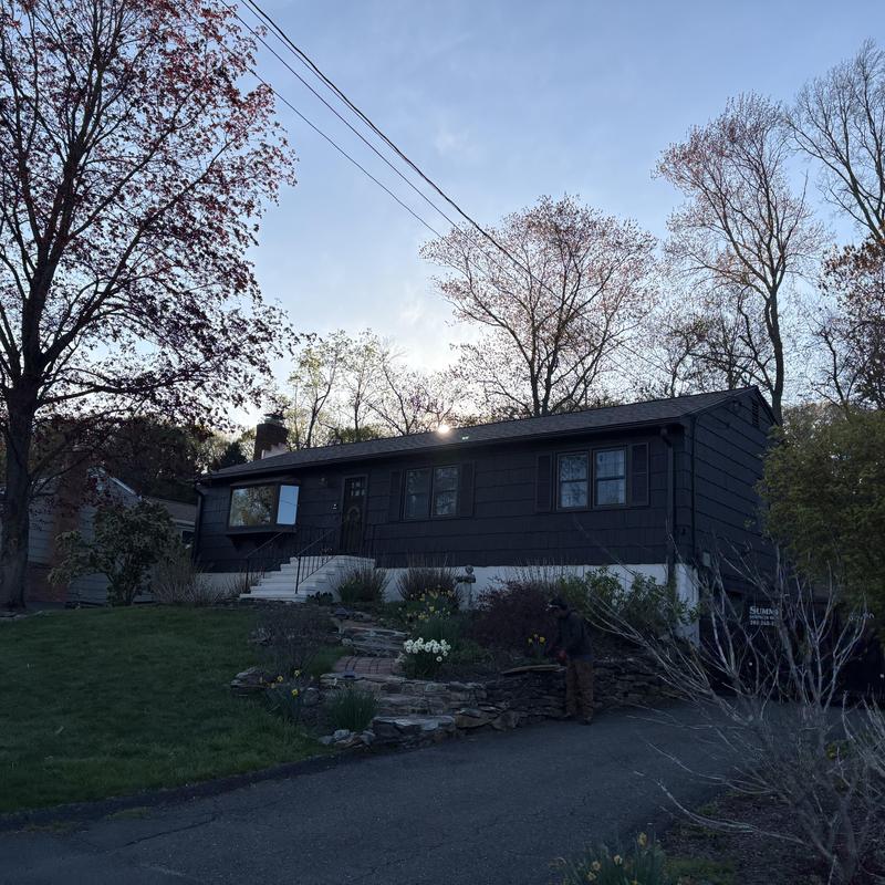 Skylight and roof on residential house at dusk