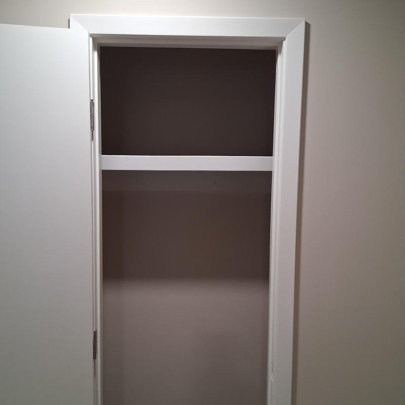 Attic scuttle hole with framed removable shelf and trim