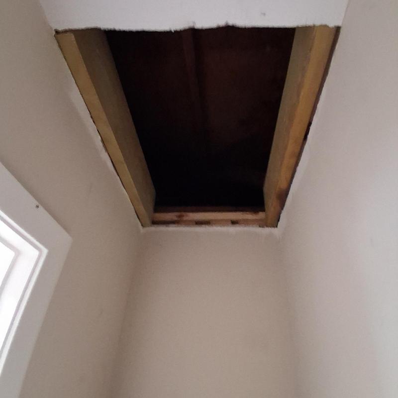 Attic scuttle hole framing with removable shelf