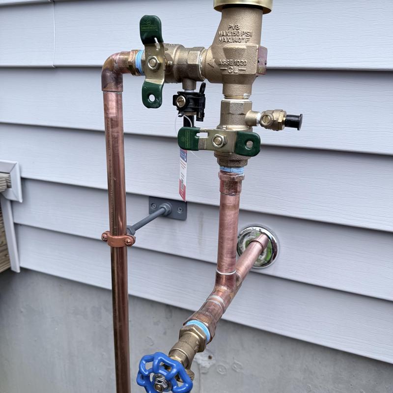Irrigation backflow assembly with new silcock installed